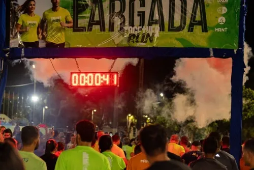 Corredores participam de prova na orla durante edição anterior da Together Run